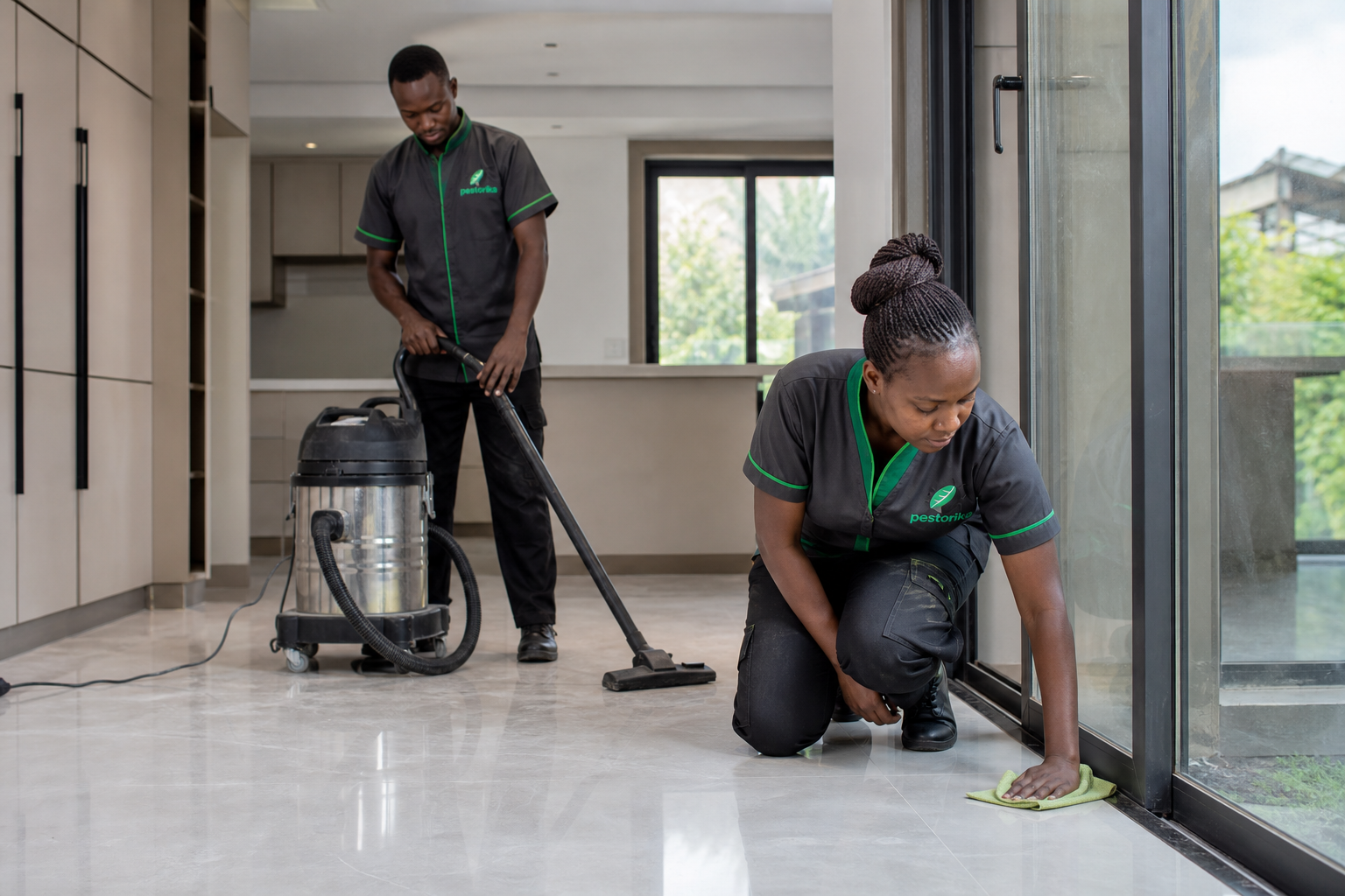 Pestorika team removing construction dust from a completed residential property